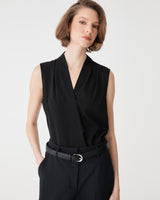 Alivia 2 V-Neck Top in black, front view worn sleeveless with black belted trousers