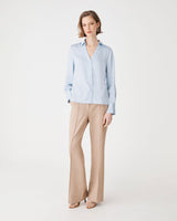 Lila V-Neck Satin Blouse in powder blue — full-length view