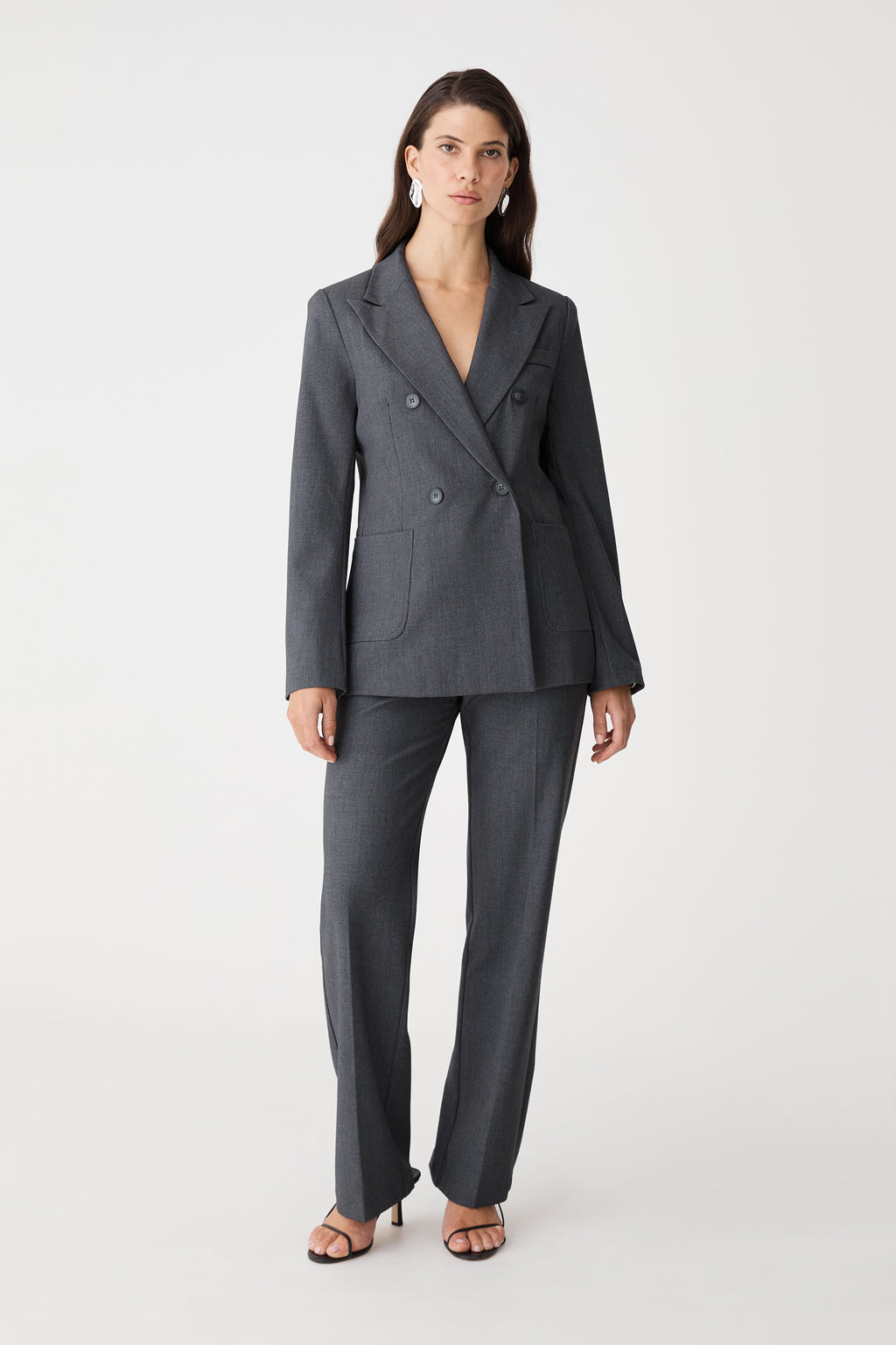 Merid Double Breasted Blazer in dark grey, front view worn with matching tailored pants