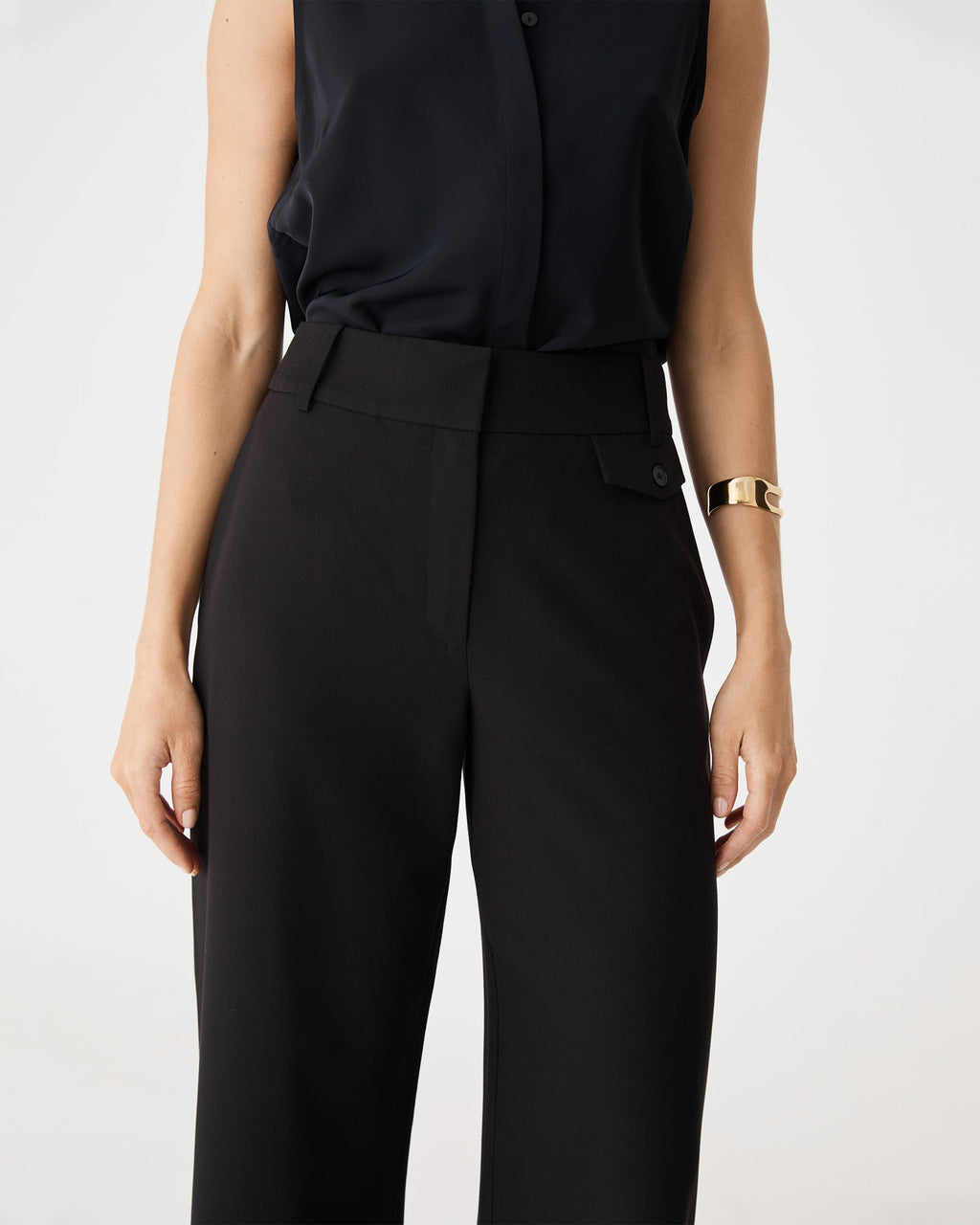 Close-up of the wide waistband, pocket flap and zip fly on the black Milton Wide Leg Pants