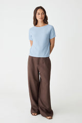 Brandy Relaxed Cotton Knit Top in powder blue, front view worn with brown wide-leg trousers