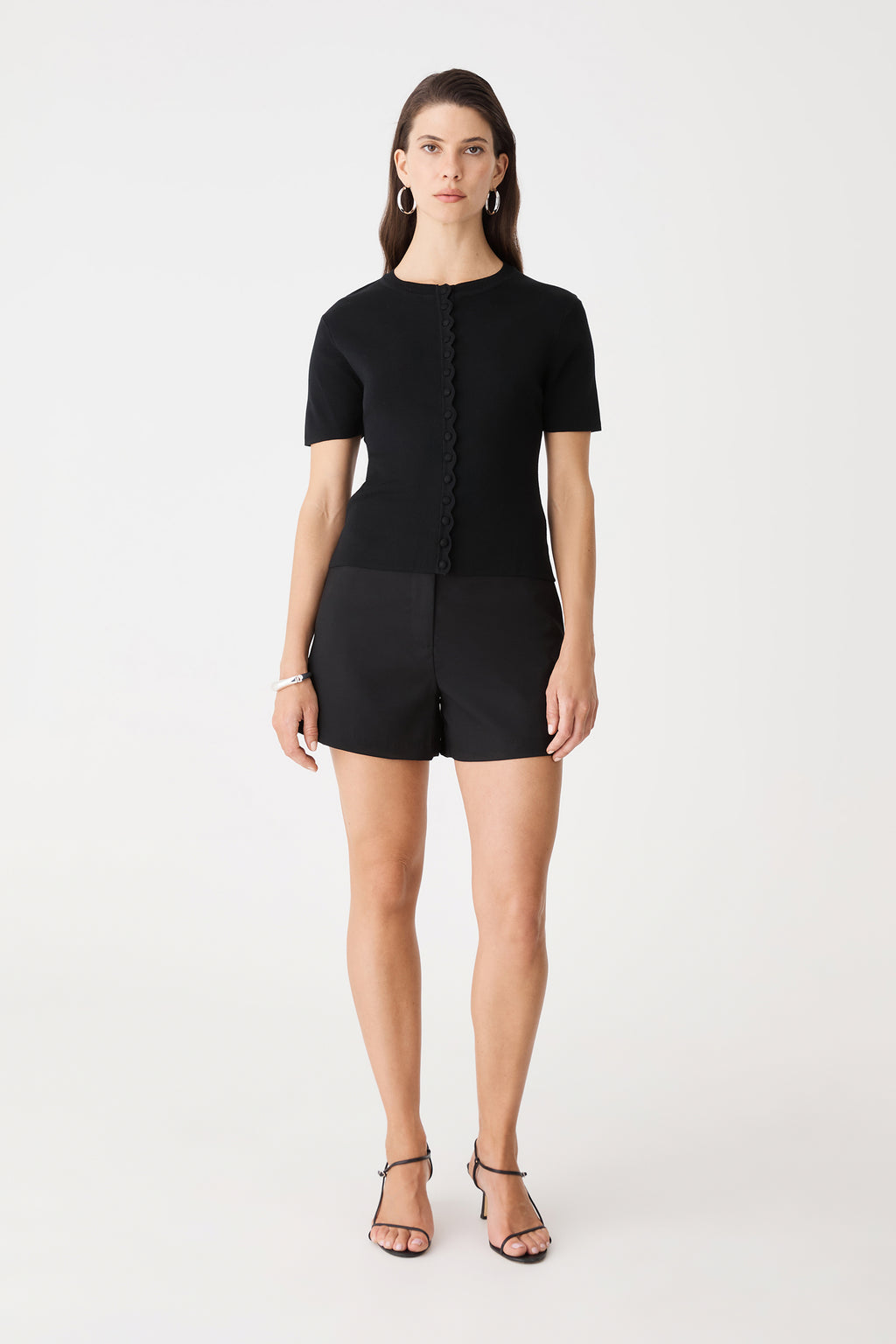 Mel Short Sleeve Scallop Knit in black, front view worn with black shorts