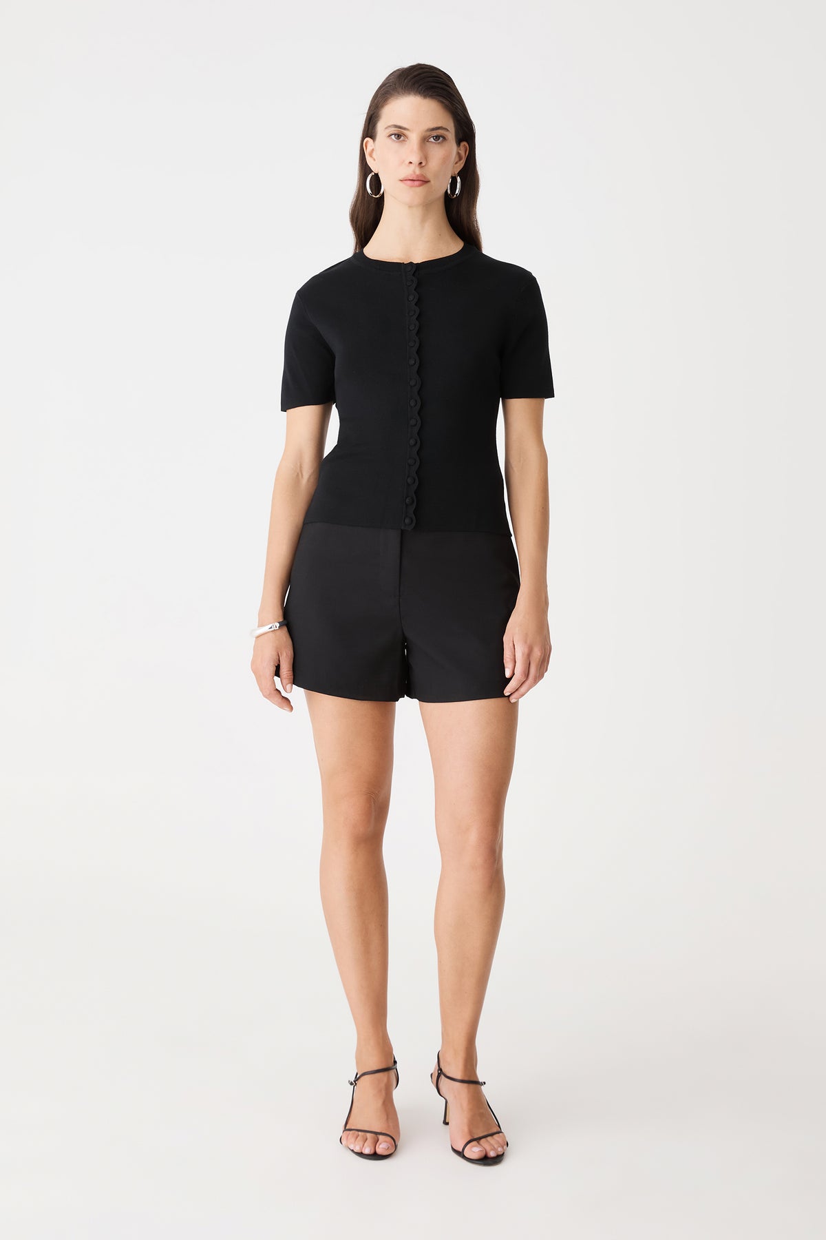 Mel Short Sleeve Scallop Knit in black, front view worn with black shorts