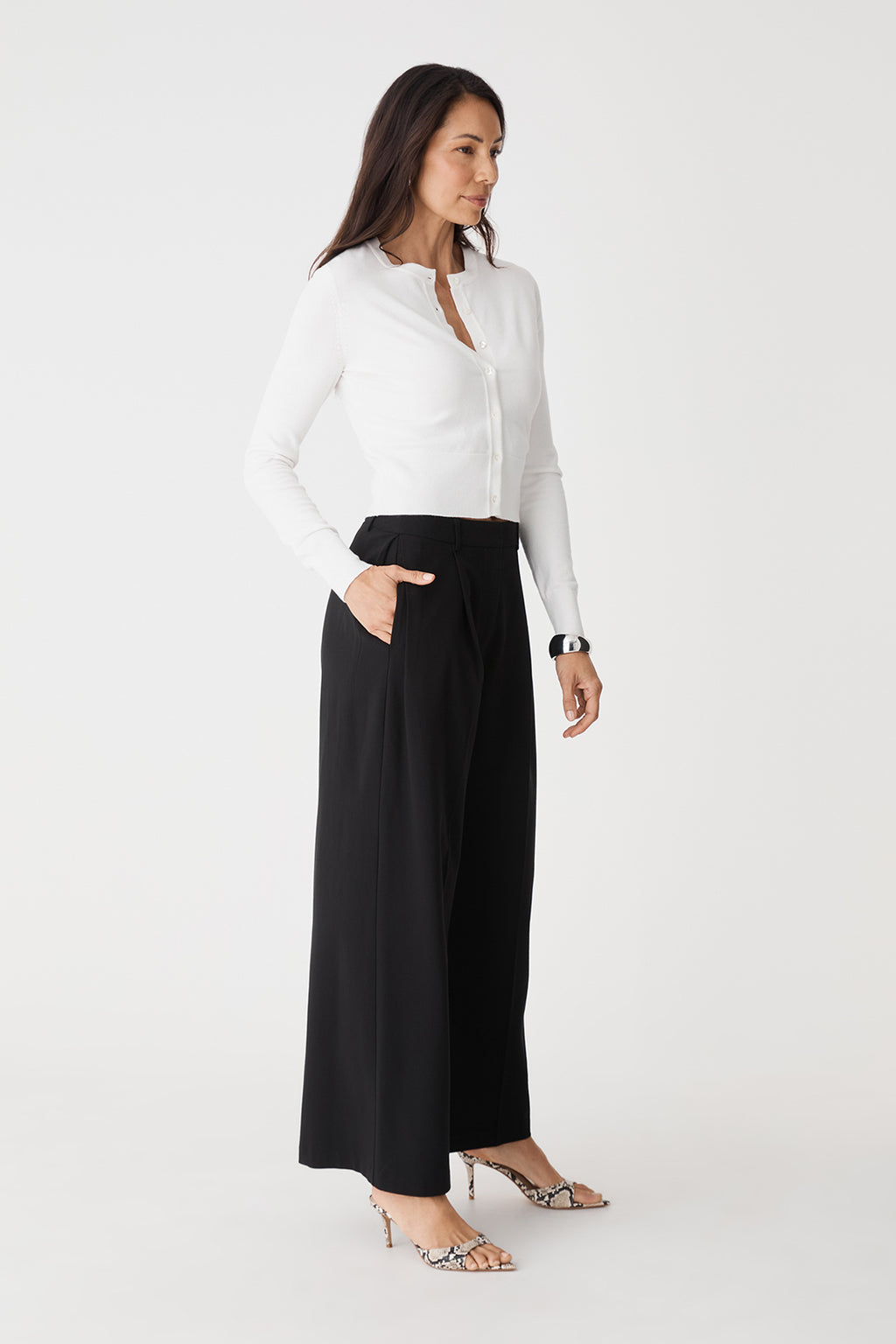 Side view of the black wide-leg pants in full length