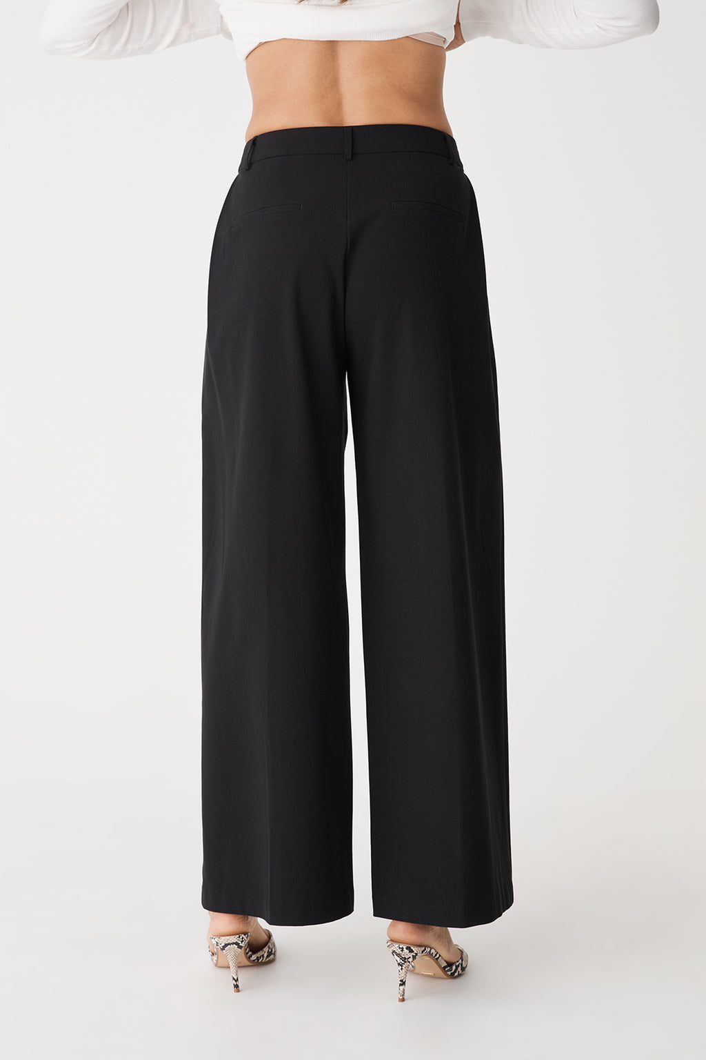 Back view showing back welt pockets and belt loops