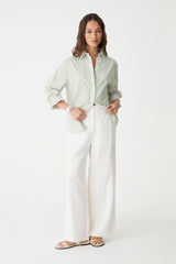 Ami 2 Linen Elastic Back Pants in ivory, front view worn with a pale green shirt