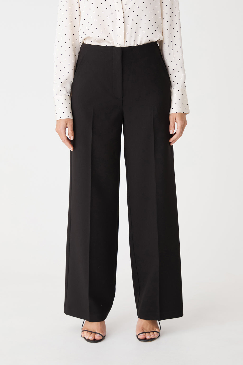 Front view of the black straight leg pants, cropped at the waist and hem