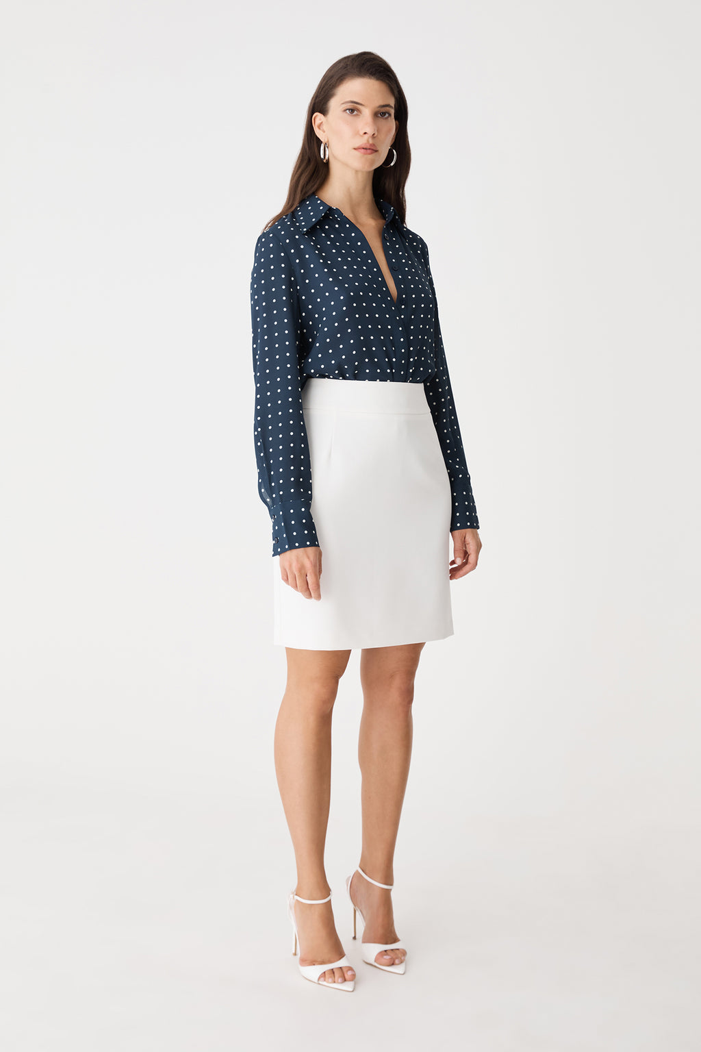 Side view of the ivory Lydia Short Straight Skirt with navy print shirt