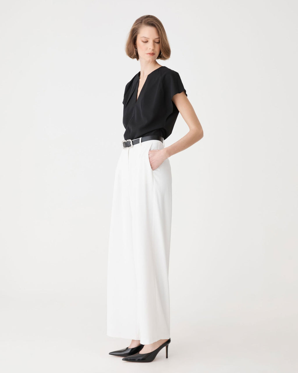 Side view of the black top showing relaxed dolman shape