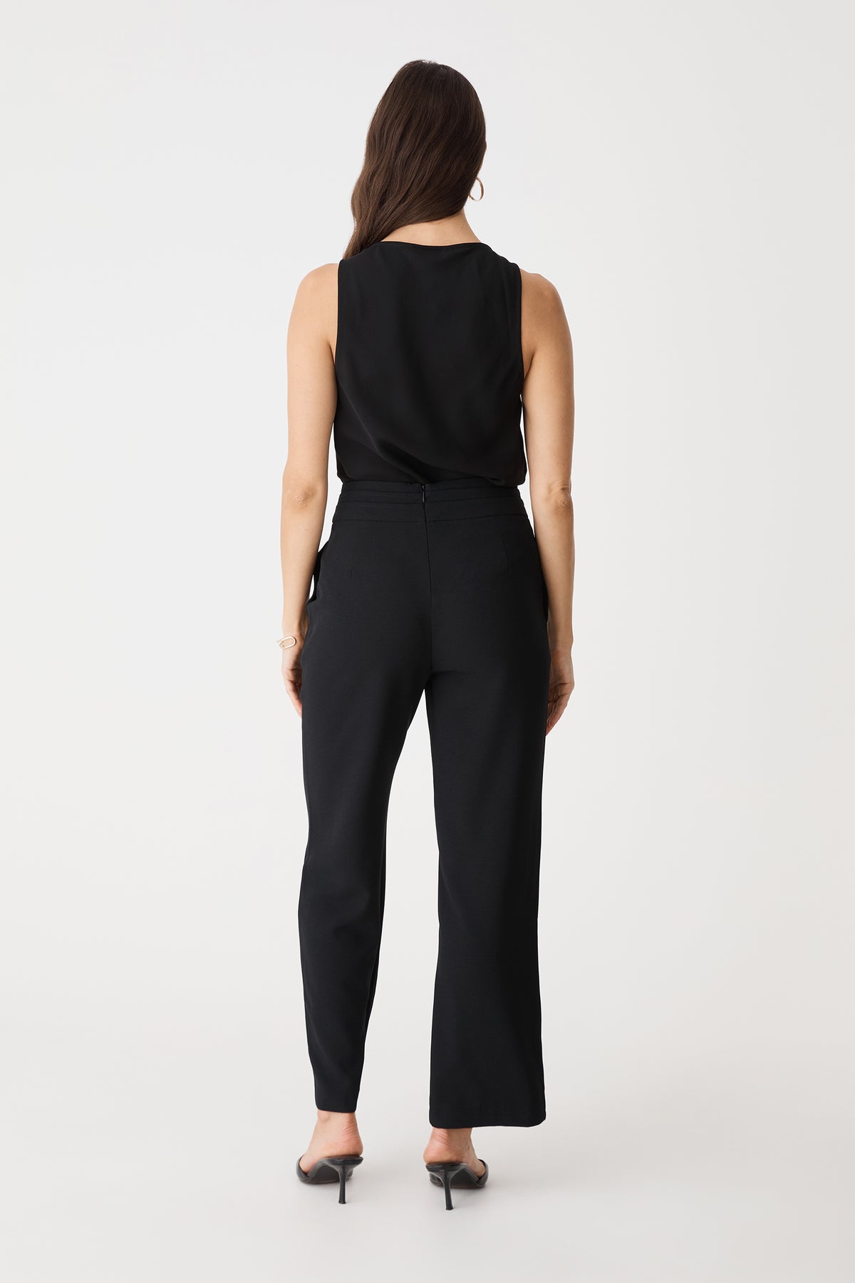 Back view of the black sleeveless top with black trousers