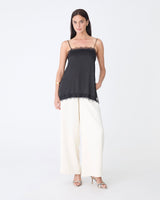 Cleo Lace Trim Satin Camisole in black — full-length view