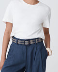 Close-up of the Maya Braid Belt two-tone braid and matte black square buckle at the waist
